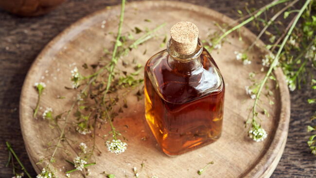 herbal tincture on a wooden board on a table