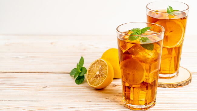 two glasses of iced lemon tea with mint