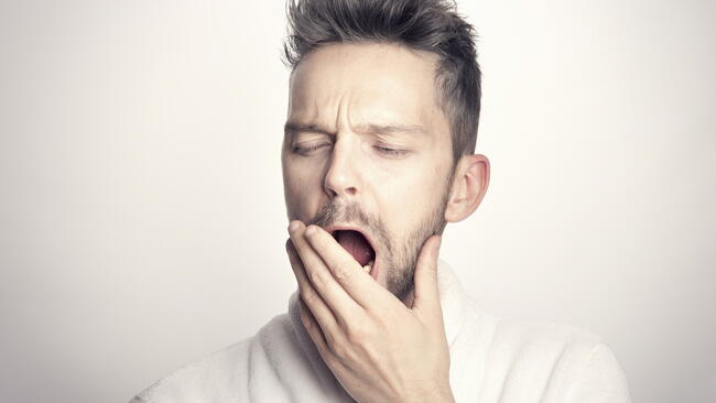 tired guy that is yawning