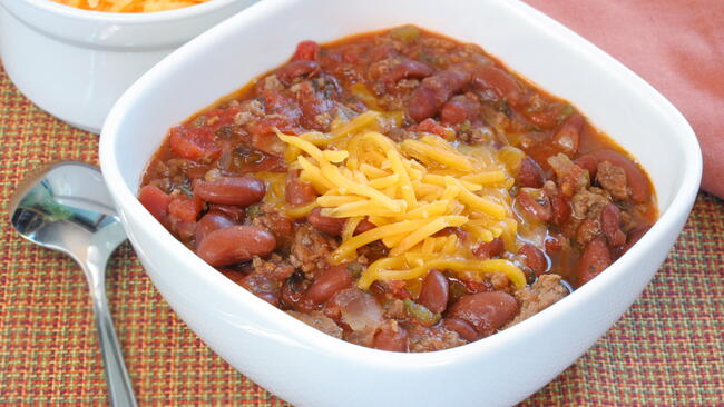 chili in a bowl with cheese