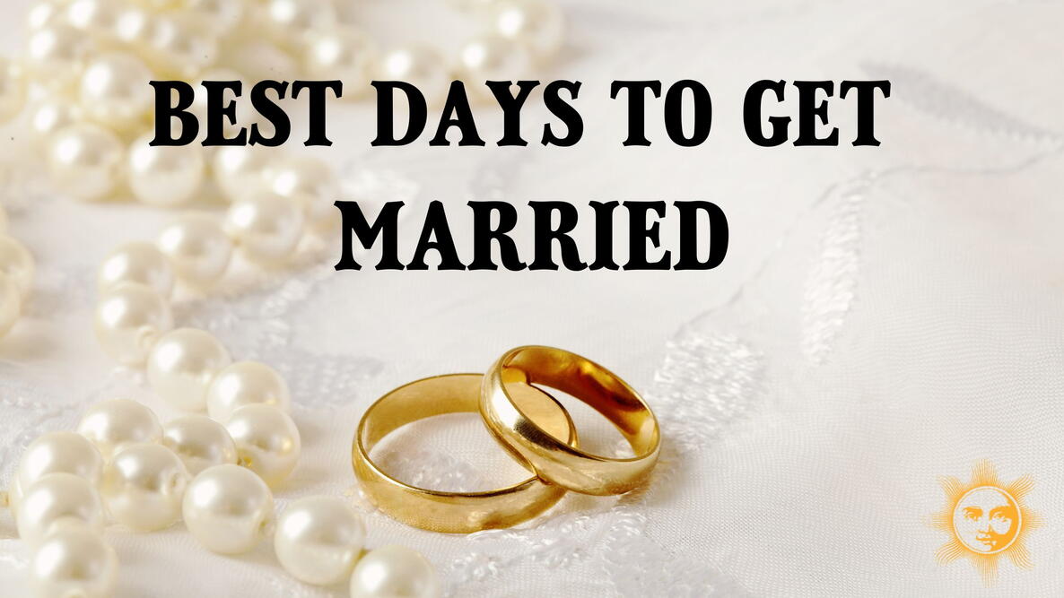 best days to get married, wedding rings and pearls on white