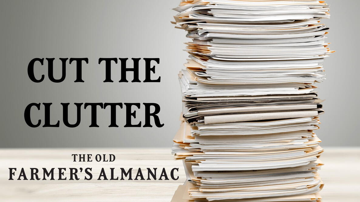 paper clutter, stack of paper with words "cut the clutter"