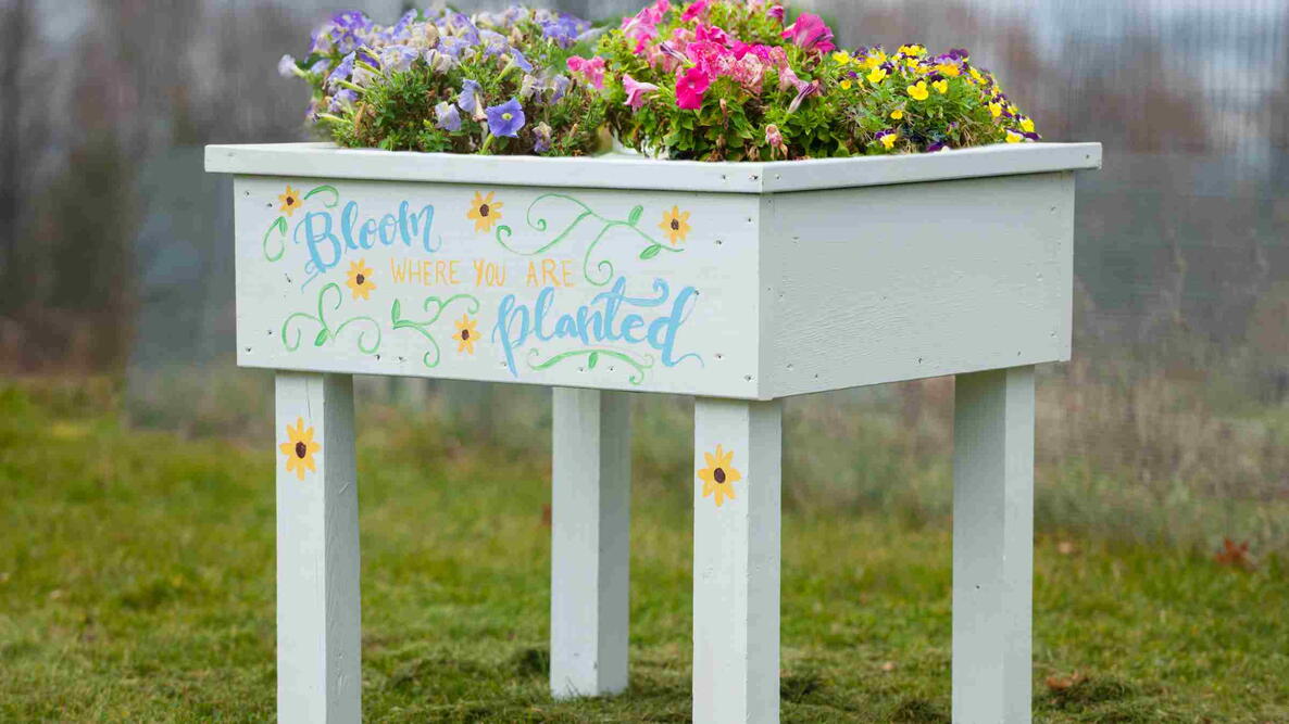DIY garden planter built with pretty flowers