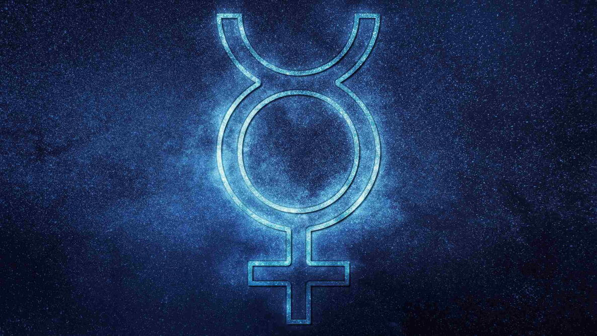 Mercury astrology symbol glowing against a starry night sky