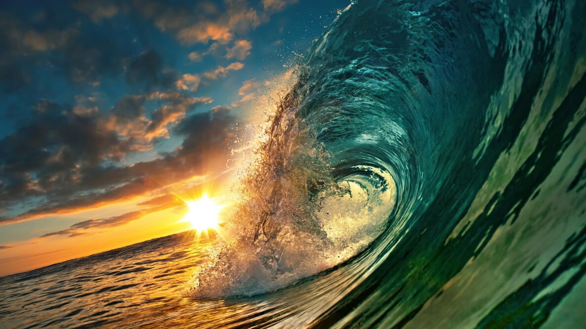 Ocean wave at sunset