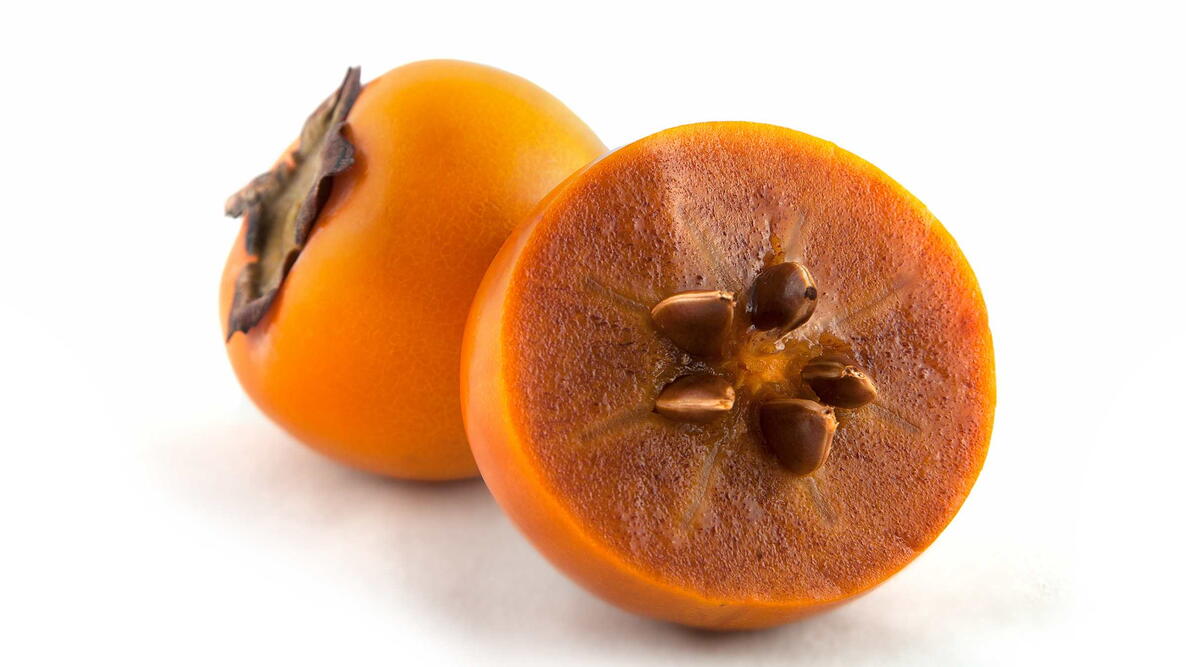 persimmon isolated on white background, use persimmon seed to predict the winter weather