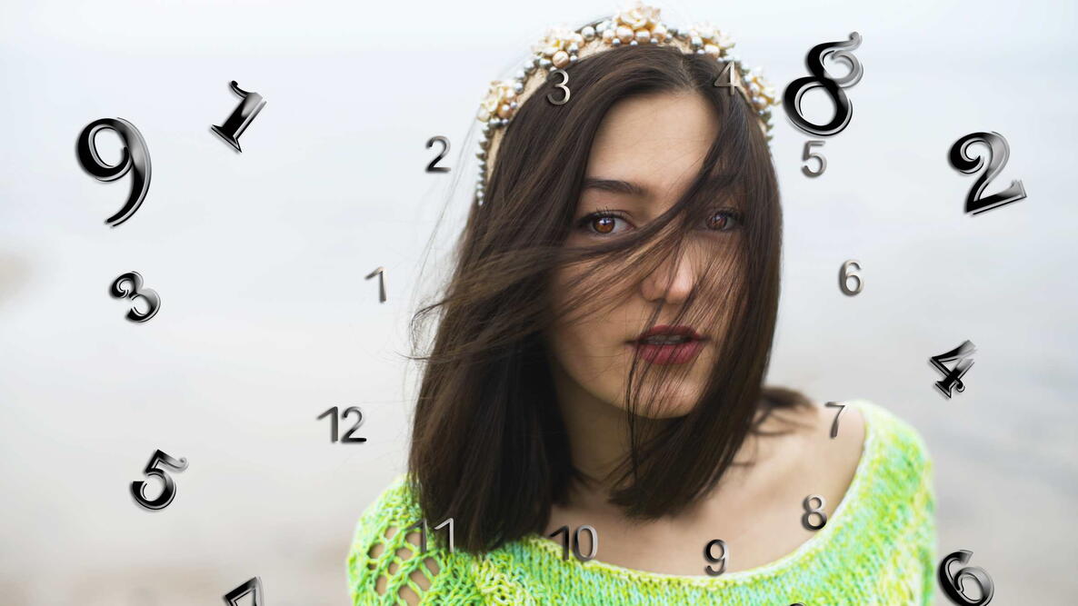 numerology, magic of numbers, woman in green with numbers swirling around her