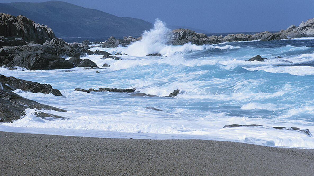 waves crashing on a rocky coast