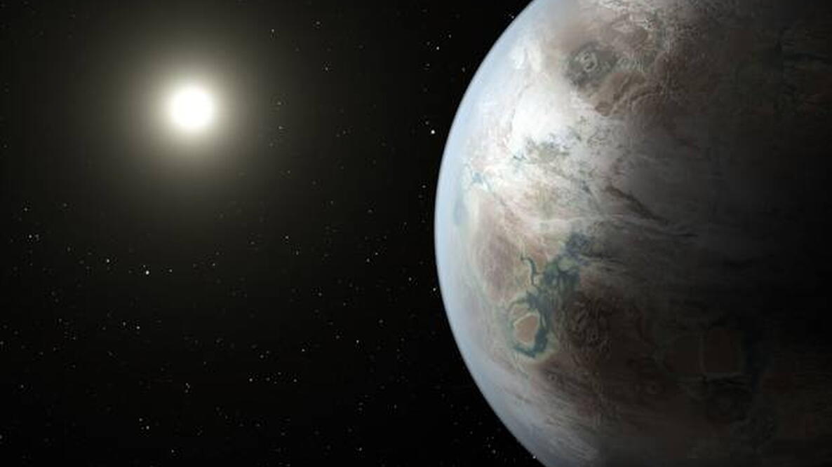 an earth-like planet shown with the sun in the background