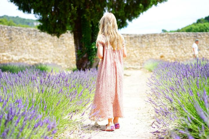 girl in a lavender garden on a pathway