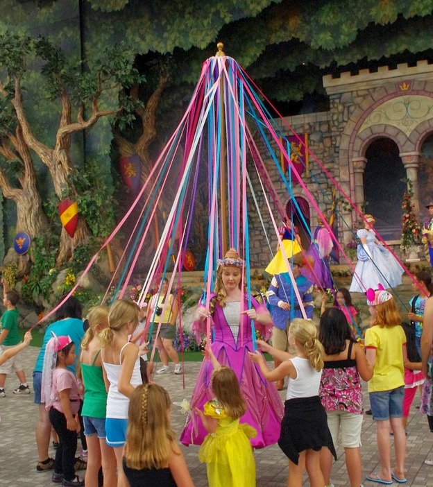 disney maypole with children around it