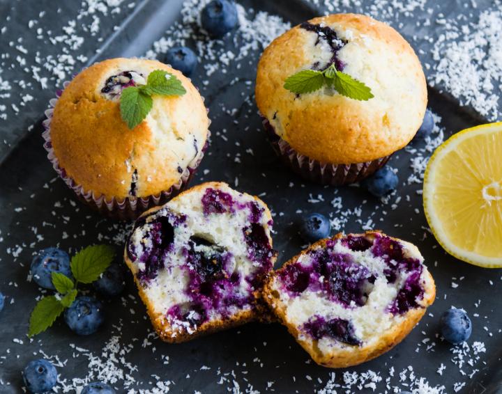lemon blueberry muffins with a mint sprig