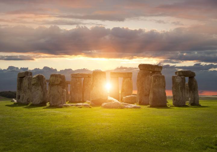 stonehenge on midsummers day with the sun