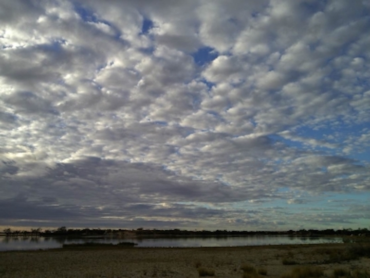 Stratocumulus clouds over a lake